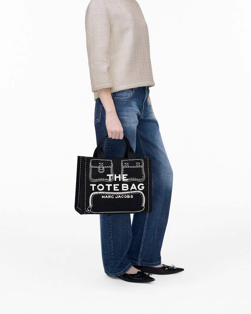 bolsa tote média em lona com estampa trompe loeil